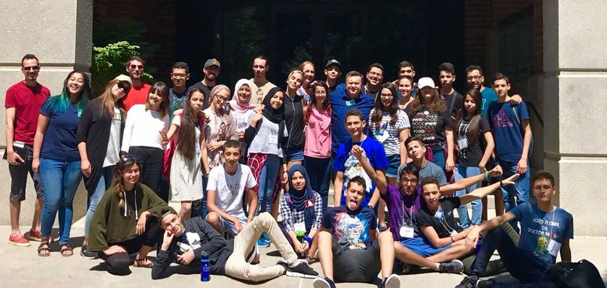 A large group of people outside the Reynolds School of Journalism 