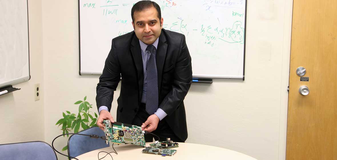 Arslan Munir with a prototyping board