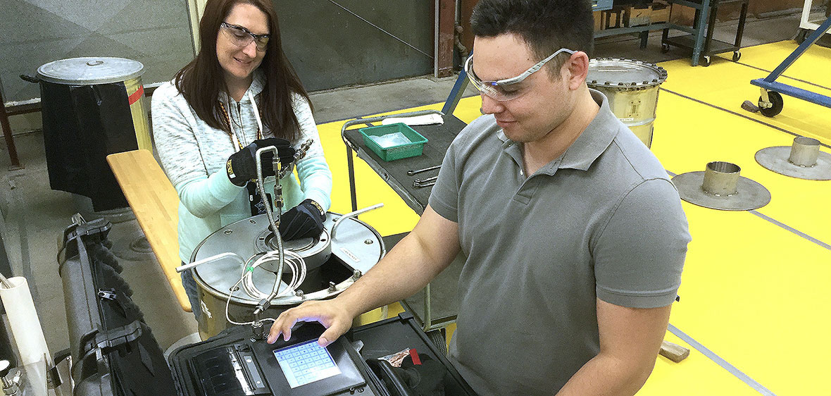 Daniel Perlstein works on leak test machine