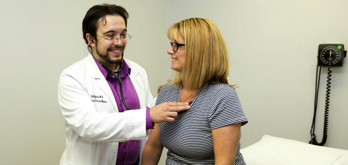 Doctor checking a patient's heart with a stethoscope