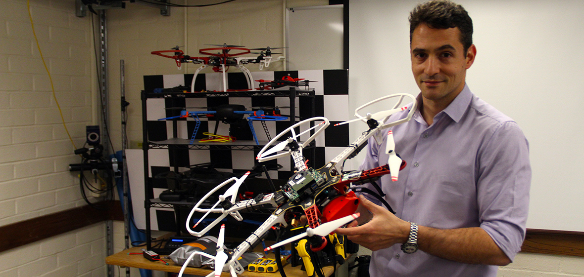 Kostas Alexis holding a drone