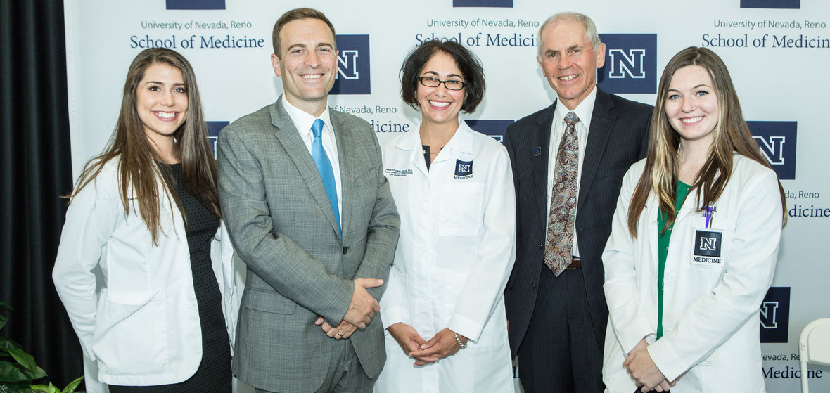 Group of students and professors posing. Left to right: Alexandra Magliarditi, UNR Med student; Attorney General Adam Laxalt; Interim Chair of the UNR Med OB/GYN department, Neda Etezadi-Amoli, M.D.; UNR Med Dean Thomas L. Schwenk, M.D.; Melissa Kelley, UNR Med student. Photo: Theresa Danna-Douglas.