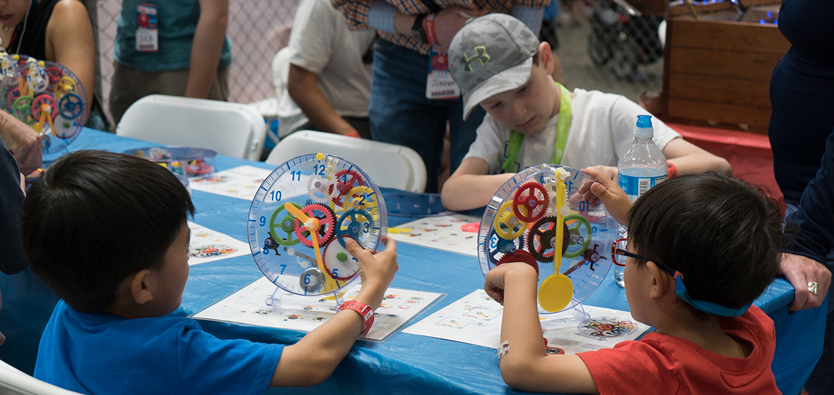 A group of kids participate in a Maker Faire