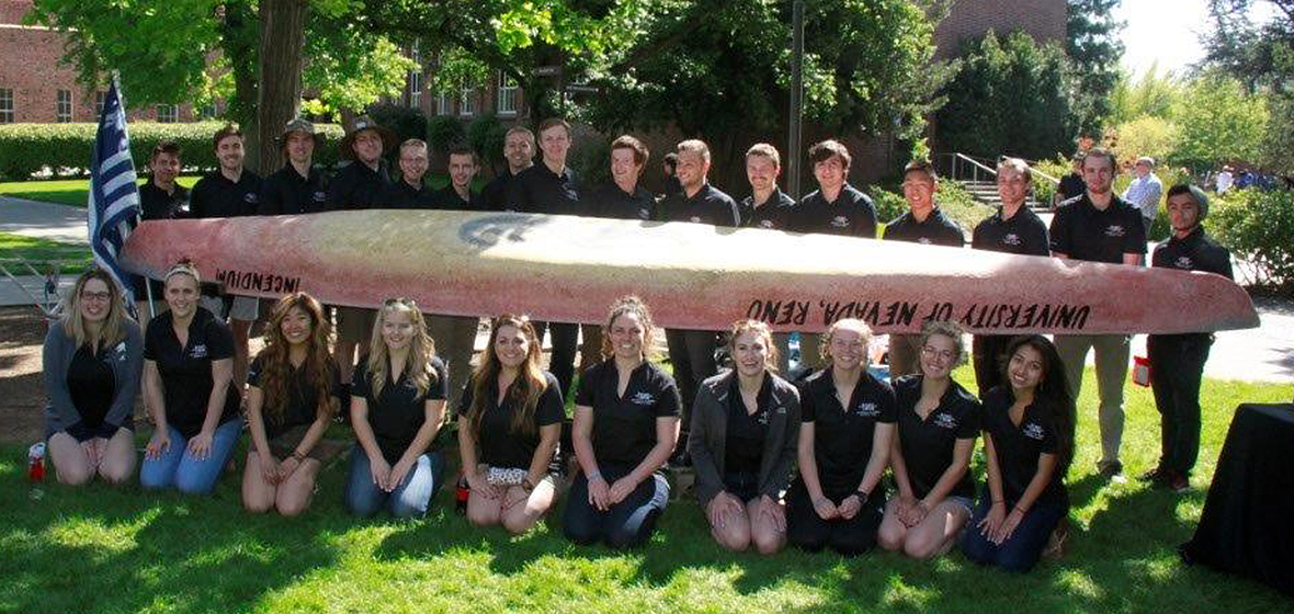 2017 UNR concrete canoe team pose next to their canoe