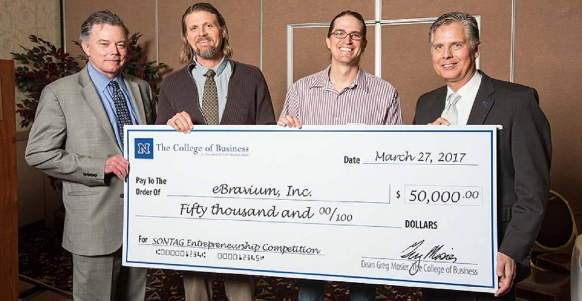 Executive Vice President and Provost Kevin Carman, Patrick Grimes, Cody Grimes and College of Business Dean Greg Mosier pose behind a Sontag Entrepreneurship Competition check to eBravium for $50000.