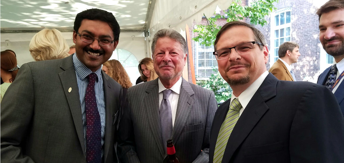 Ravi Subramanian posing for a photo with Ambassador Adams Jr and Orlando Rojas