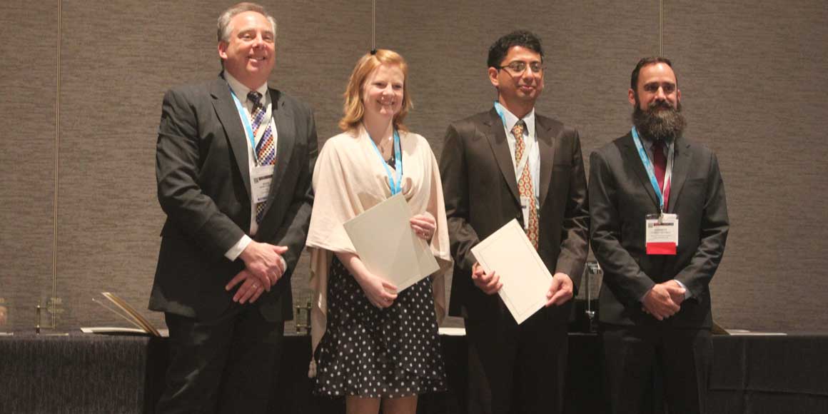 Sid Pathak receives his award with other members of The Minerals, Metals and Materials Society