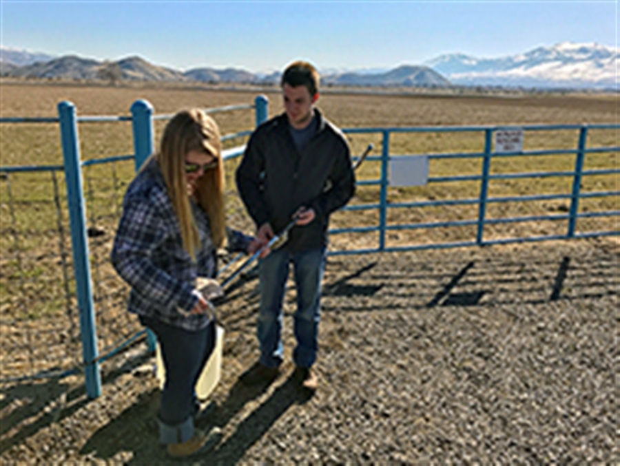 students sampling soil at main station