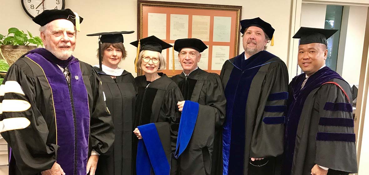 Judicial Studies Graduates in formal commencement hoods