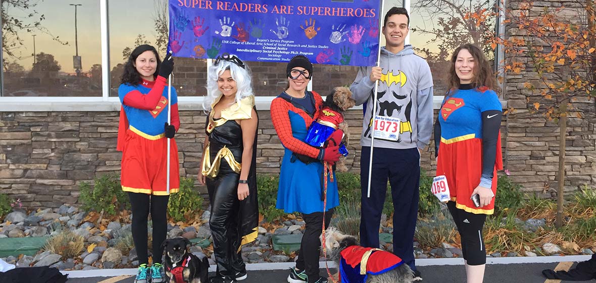 Literacy Program members dressed up in super heroes costume