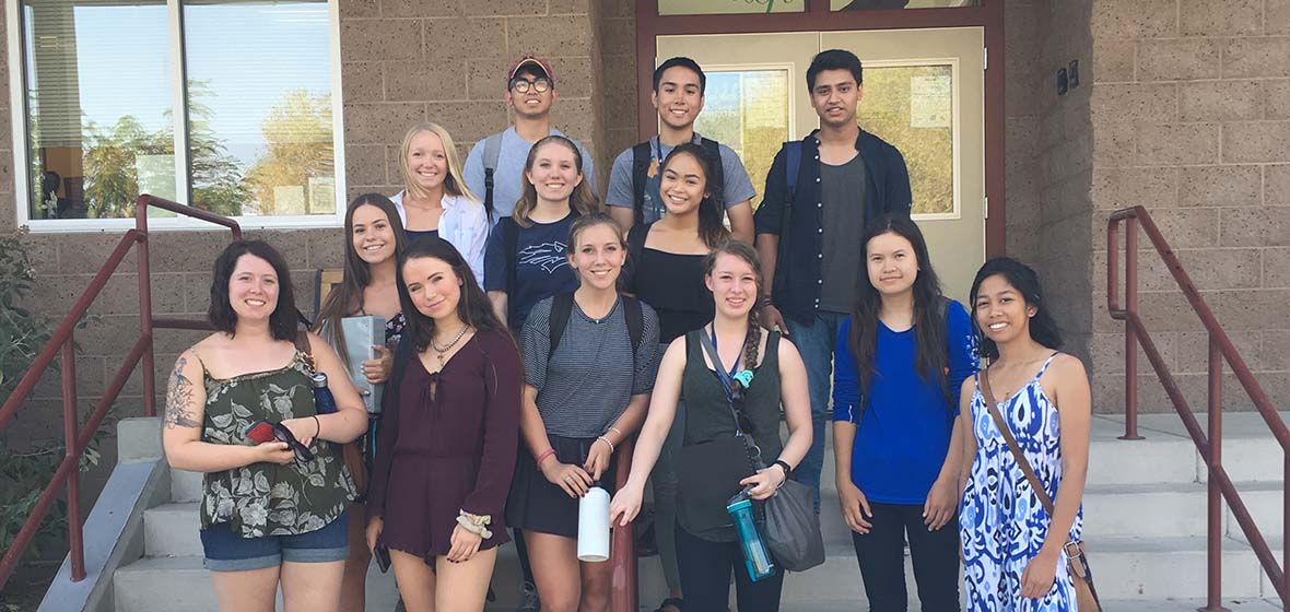 University Honors Program student group outside on steps of Reno Elementary School