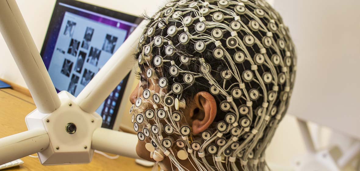 Integrative Neuroscience research shows person with HD EEG technology on head