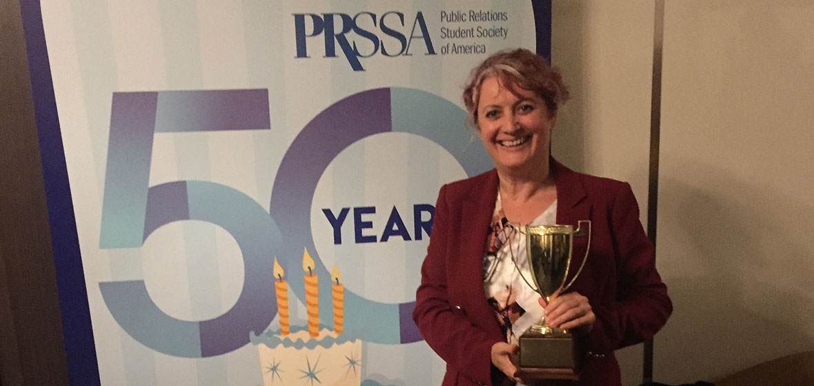 Alison Gaulden poses with her award at the national PRSSA Conference in Boston, MA. 
