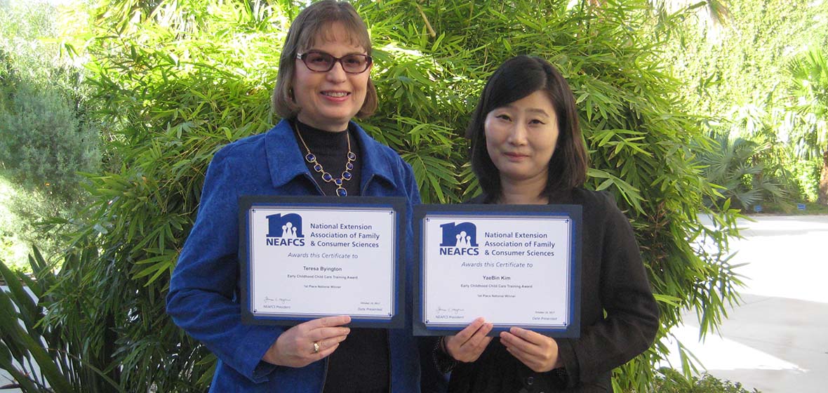 Teresa Byington and YaeBin Kim display their awards