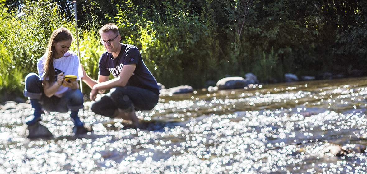 Two students conducting research on the Truckee River. 