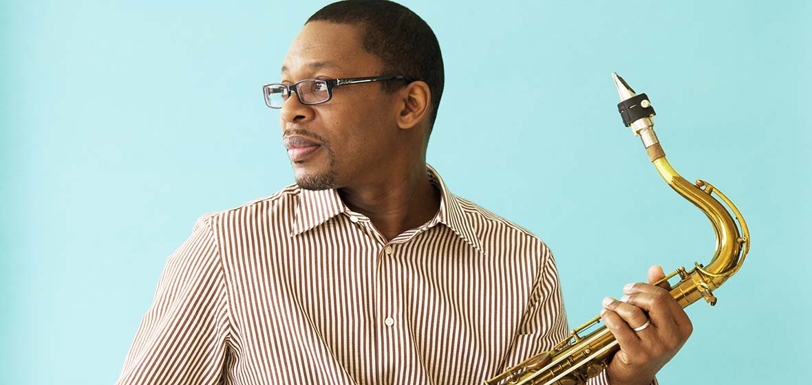 Ravi Coltrane poses with saxophone