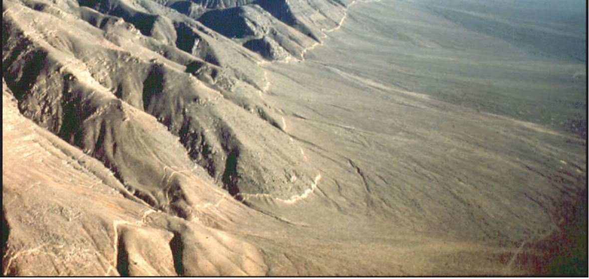 A photo showing the mountain range and fault line in Pleasant Valley following the 1915 earthquake. 