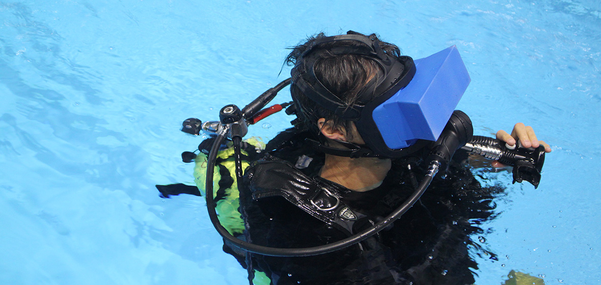Paul MacNeilage scuba diving with VR headset