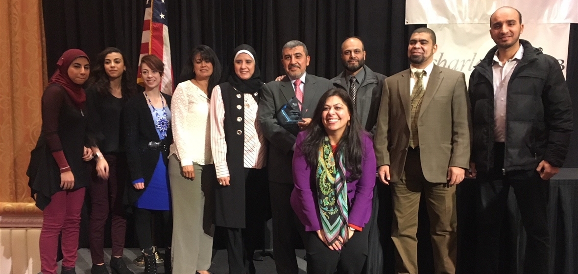 Sherif Elfass and his friends with award