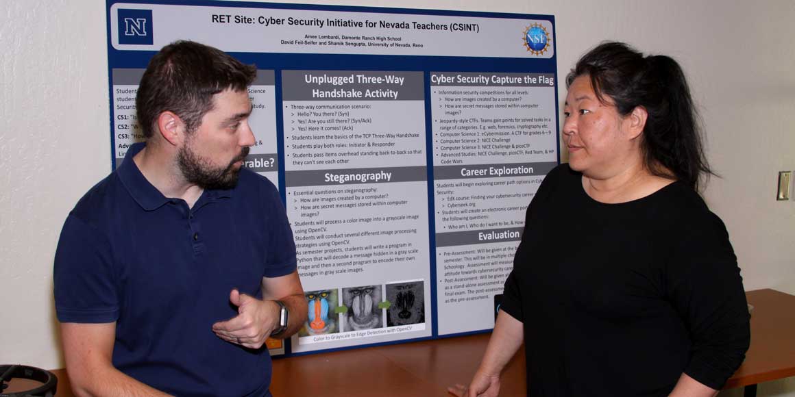 Dave Feil-Seifer and Amee Lombardi in front of her poster