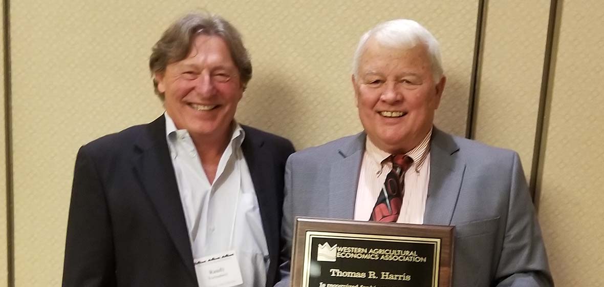 Tom Harris and WAEA President Randy Fortenbery holding Fellows award 