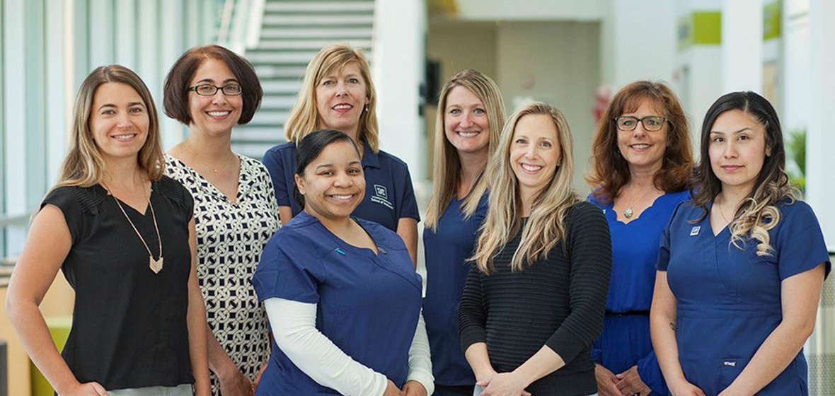 A group of UNR Med Women's Health Center staff pose for a photo. 