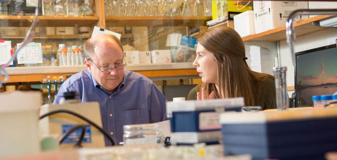 Professor Jeff Harper with a student in his biochemistry lab