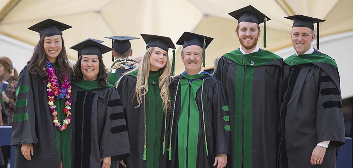 Six UNR Med School doctors pose for a photo during the 2018 spring hooding ceremony 