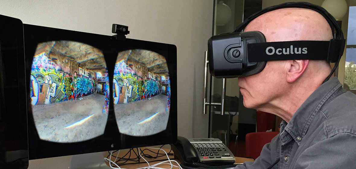 Howard Goldbaum uses an Oculus VR headset with a computer monitor displaying what he sees