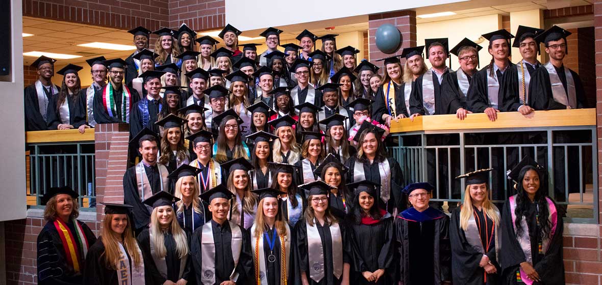 A large graduating class on a set of stairs. 