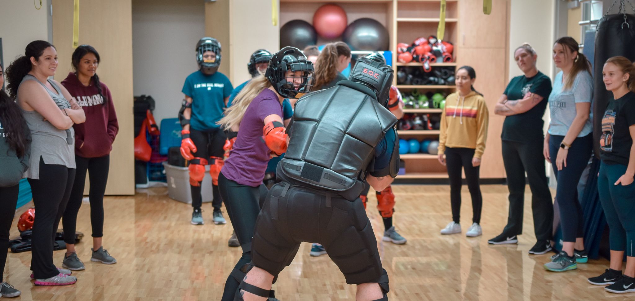 A image of students sparring in the “Girls on Guard” self-defense class, which is offered at the E. L. Wiegand Fitness Center. 