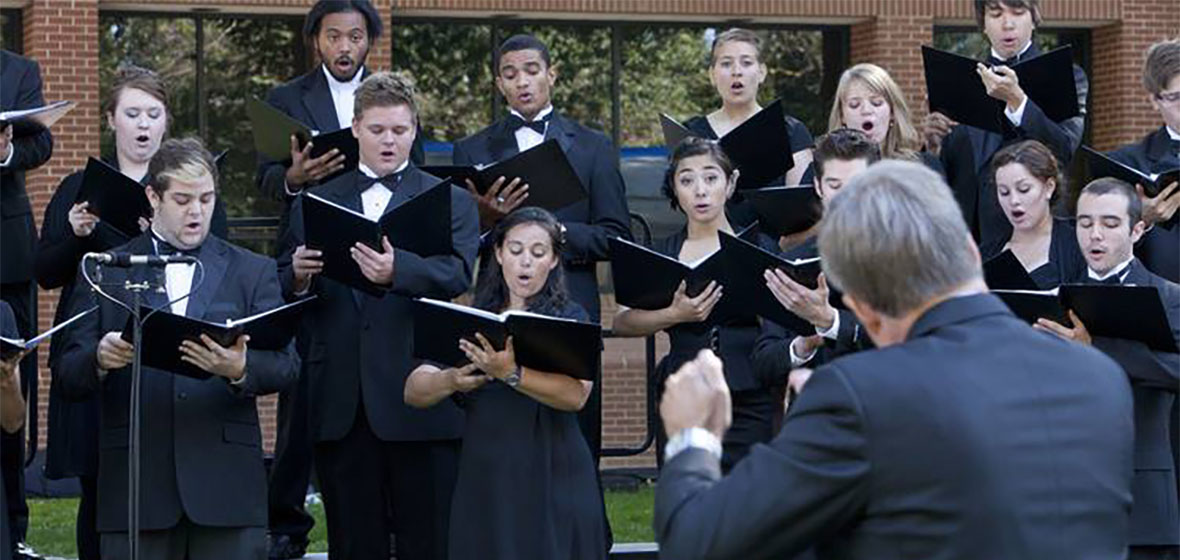 Paul Torkelson directoring choir