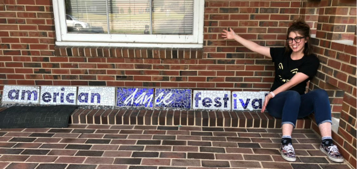 Noelle Ruggieri next to an American Dance Festival sign