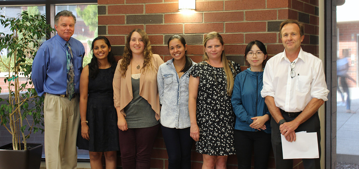 Provost Kevin Carman and Graduate Dean David Zeh with Ph.D. students