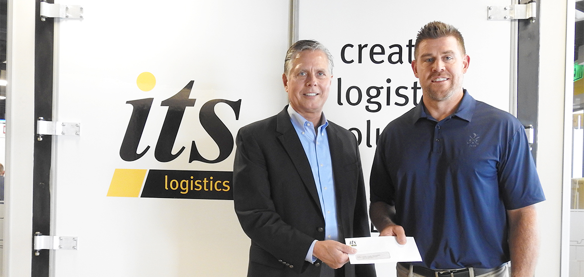 Dean Greg Mosier and ITS Logistics President Mike Crawford in front of ITS Logistics 