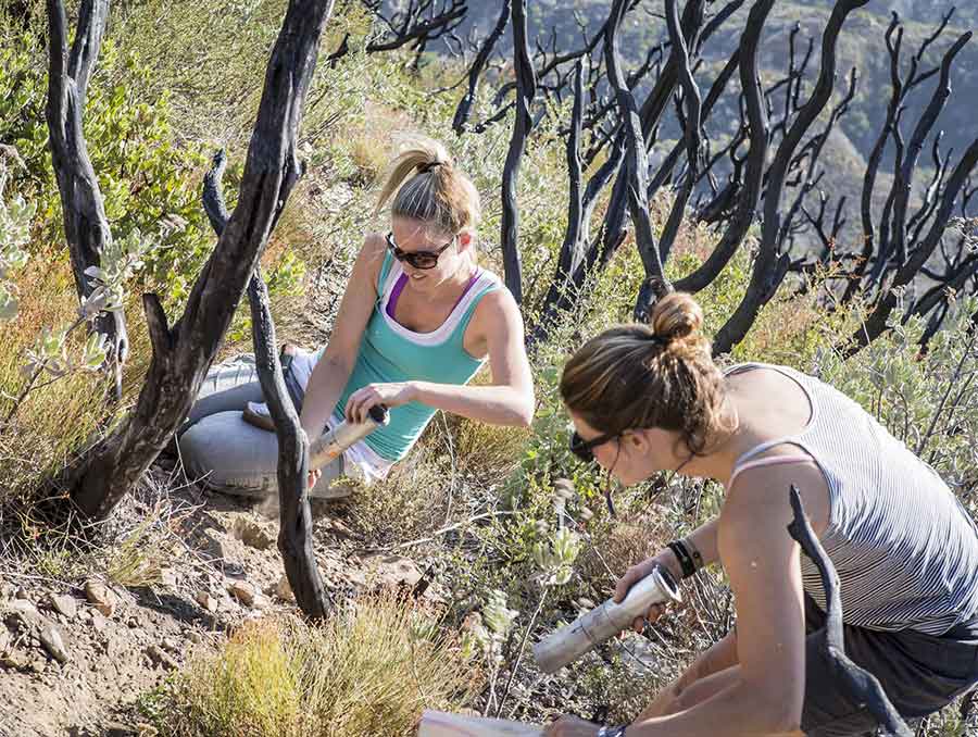 Erin Hanan and student taking soil samples