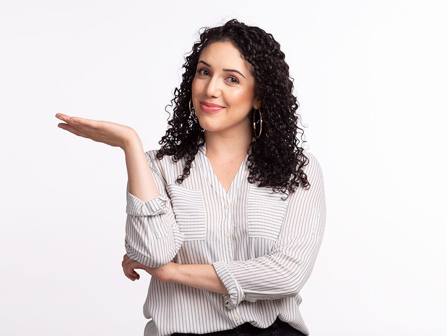 A woman poses indoors.