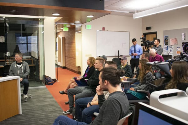 A crowd of students listen to the panelists at the podcasting event. 