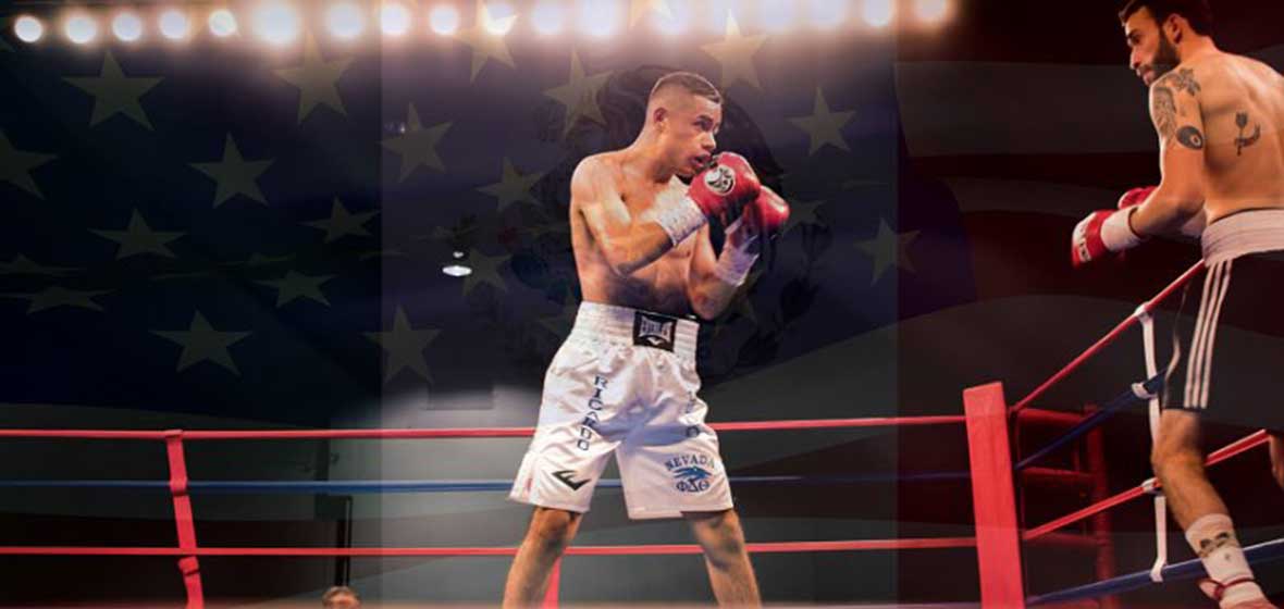 A boxer stands in a ring.