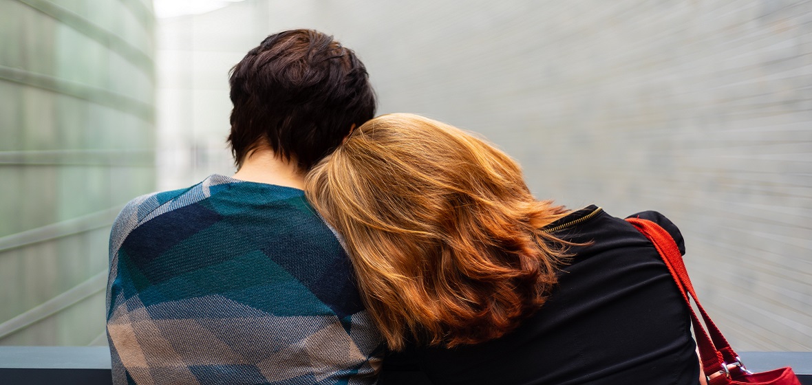 A couple posing romantically from behind