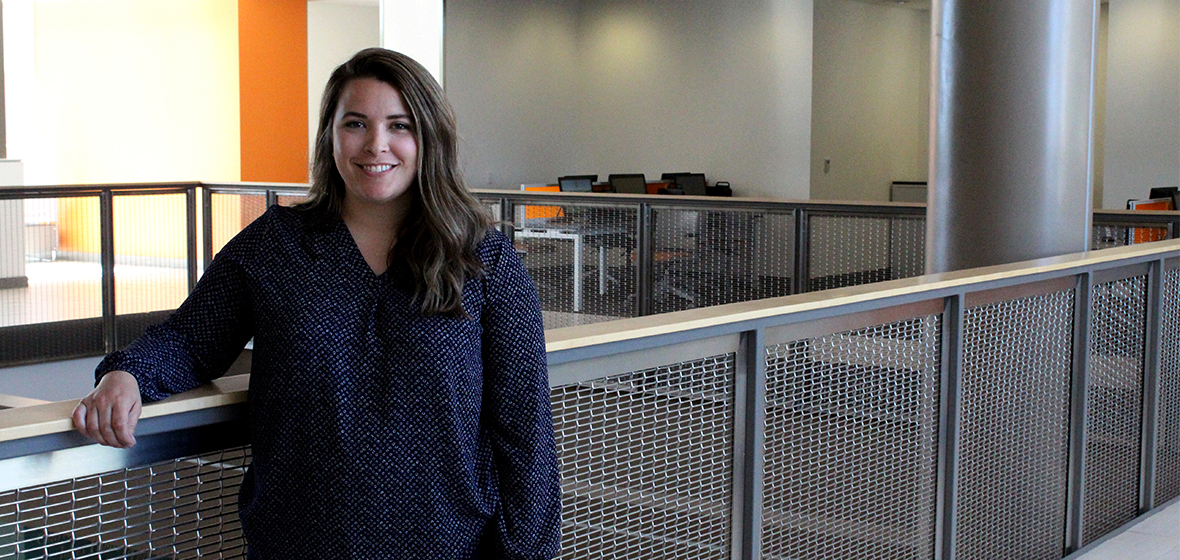 Lindsey Forbes stands in the Pennington Student Achievement Center outside of the University Advising Center. 