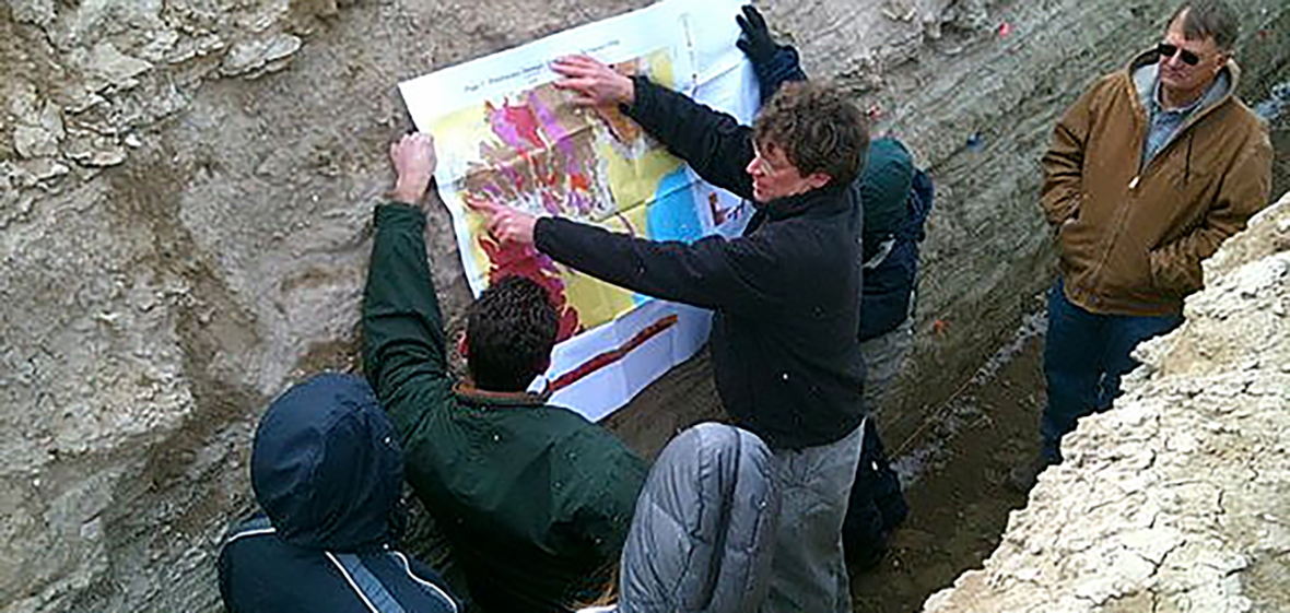 teaching geothermal class in a trench