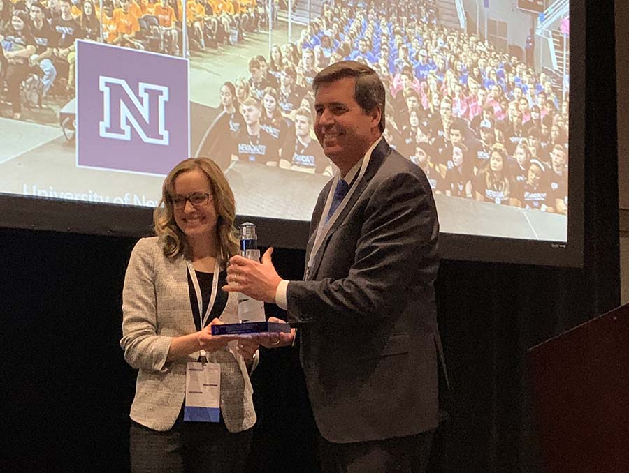 Felicia DeWald is presented with an award by Thayne McCulloh, president of Gonzaga University and vice chair of the Northwest Commission on Colleges and Universities.