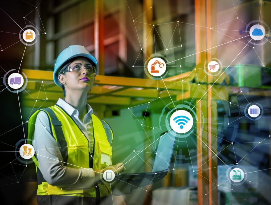 Woman wears a hardhat in an advanced manufacturing setting