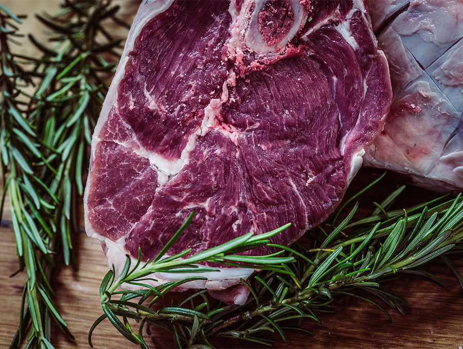 Steak on a cutting board with herbs