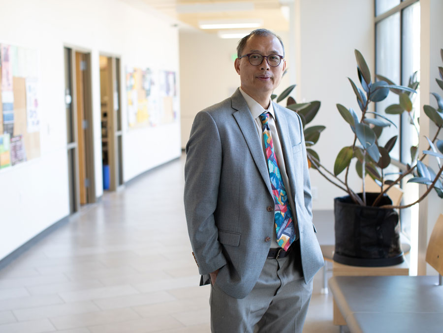 Mathematics & Statistics Department Chair Tin-Yau “T.Y.” Tam stands in the department’s hallway.