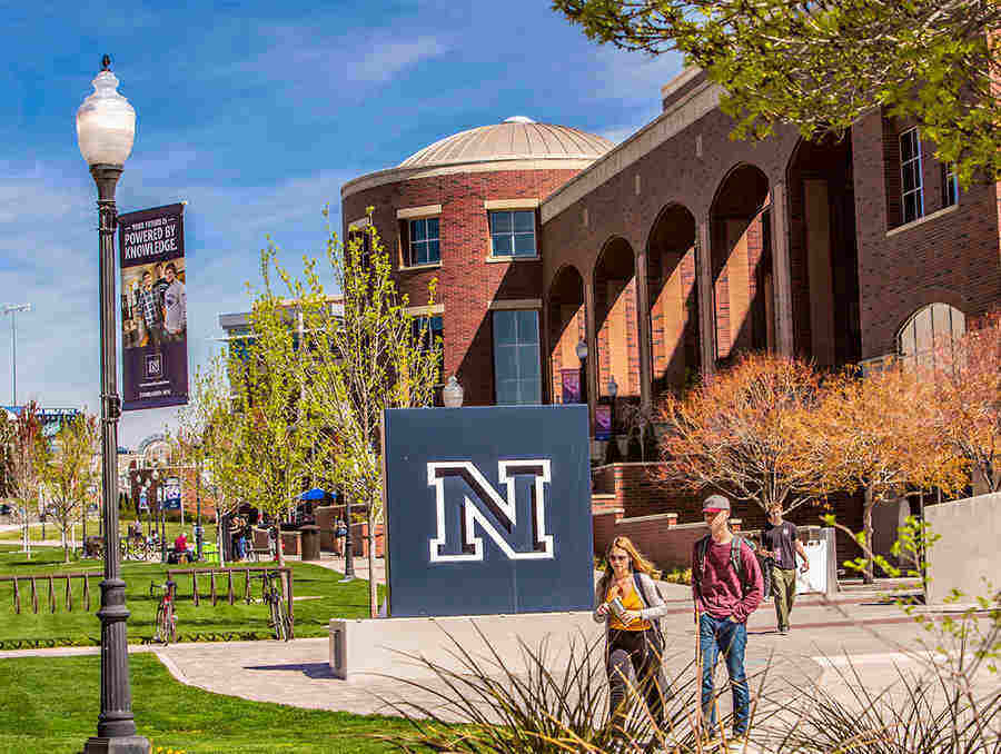 Nevada logo on campus with Mathewson-IGT Knowledge Center in background