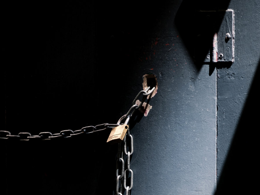 A lock attached to chains on a door