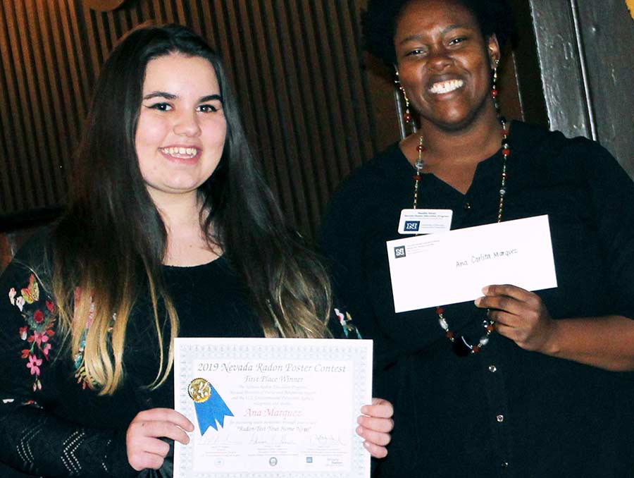 Ana Marquez posing with award 