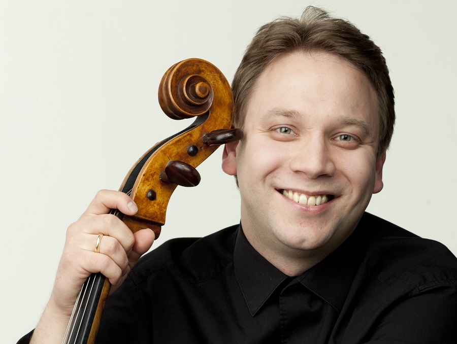 Dmitri Atapine holds his cello